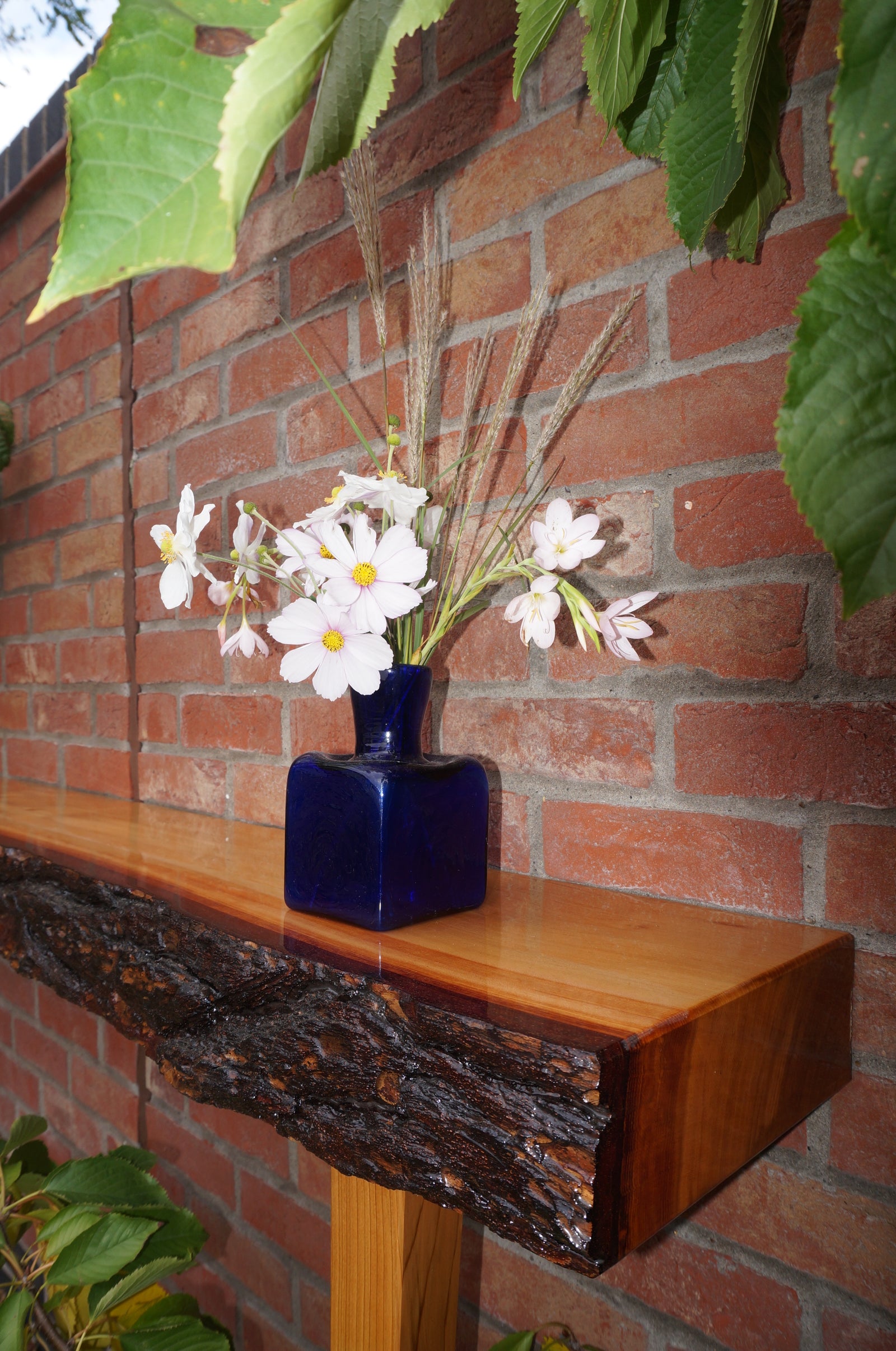 Cedar console with natural edges & liquid glass finish