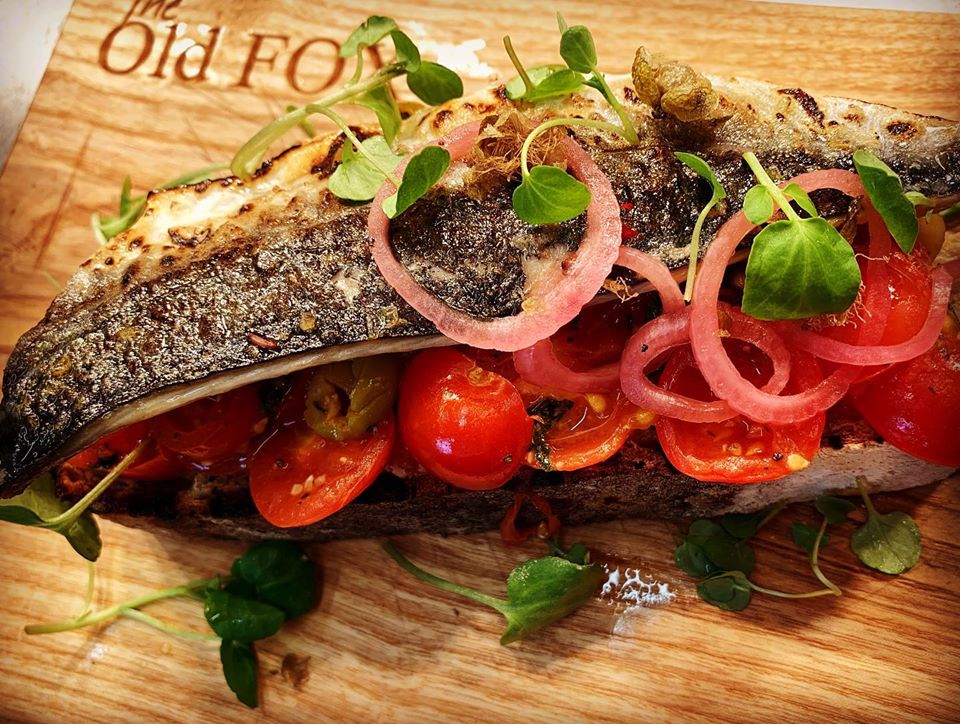Ash Carving Board covered in food