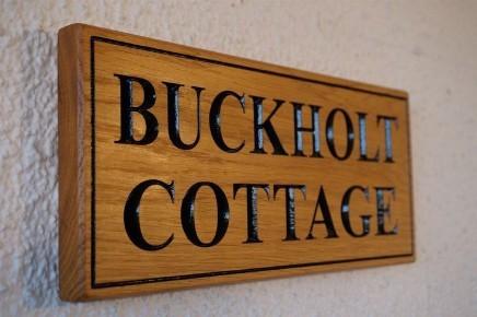 A solid oak rectangular House Name Sign, Traditional, bespoke, hand engraved, High Quality, durable, crafted in our wood working workshop,The Fine Wooden Article Company, Gloucestershire, UK