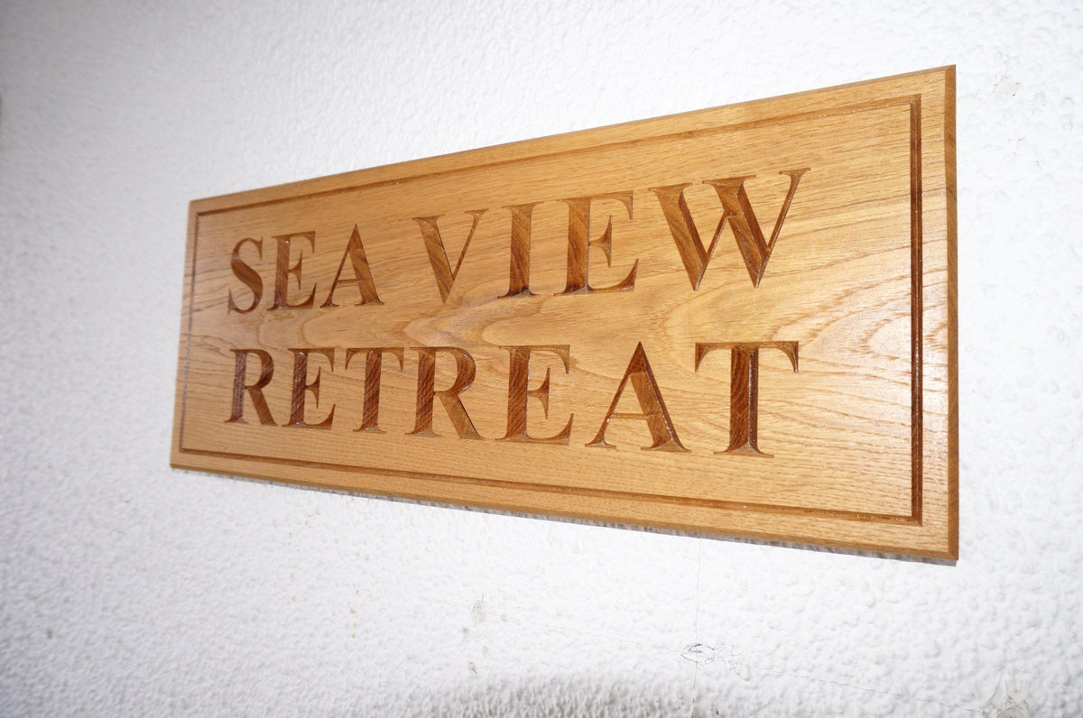 Large solid oak rectangular House Name Sign, bespoke, hand engraved, High Quality, durable, standard crafted in our wood working workshop, Gloucestershire, UK. The Fine Wooden Article Company.