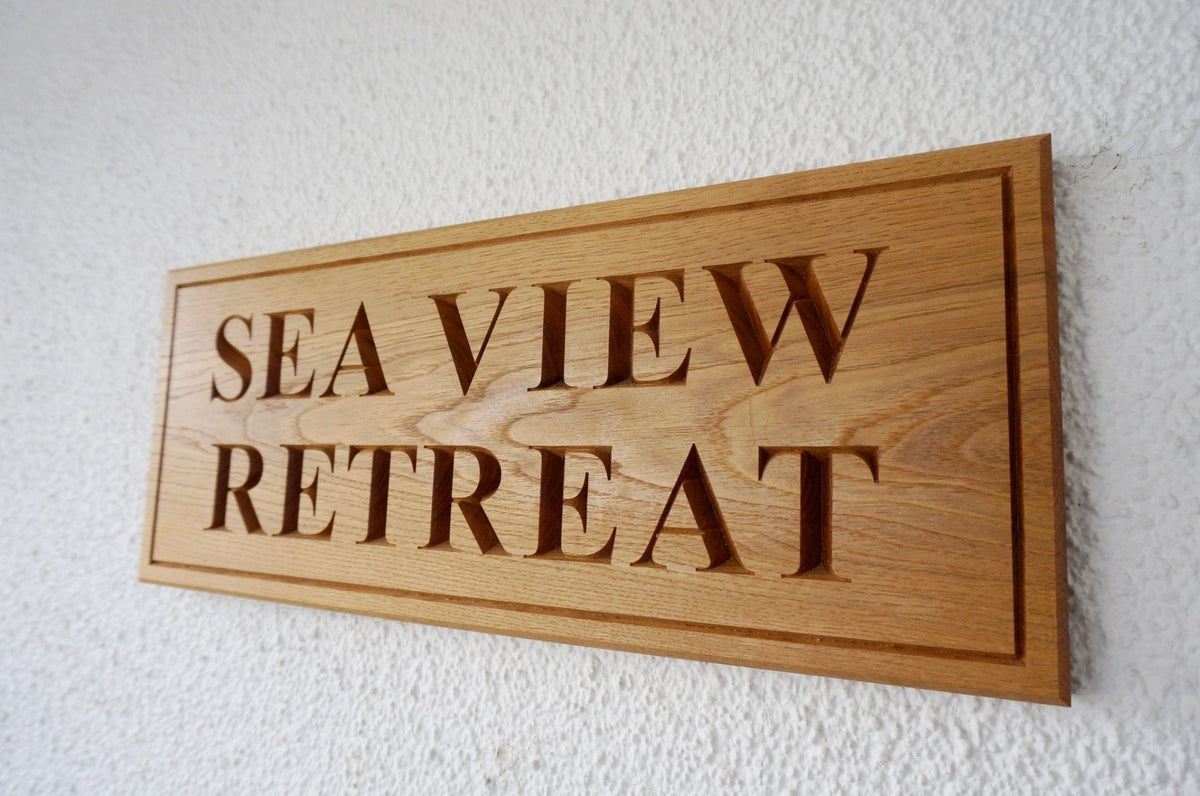 Large solid oak rectangular House Name Sign, bespoke, hand engraved, High Quality, durable, standard crafted in our wood working workshop, Gloucestershire, UK. The Fine Wooden Article Company.