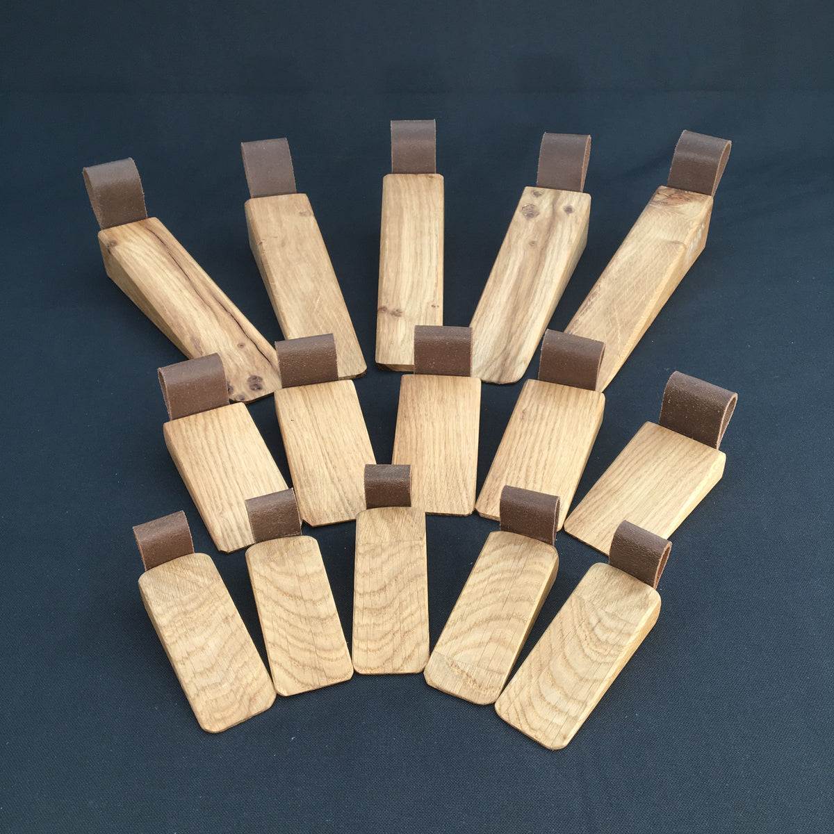 Door Wedges. Solid Oak door wedges with faux leather handle.