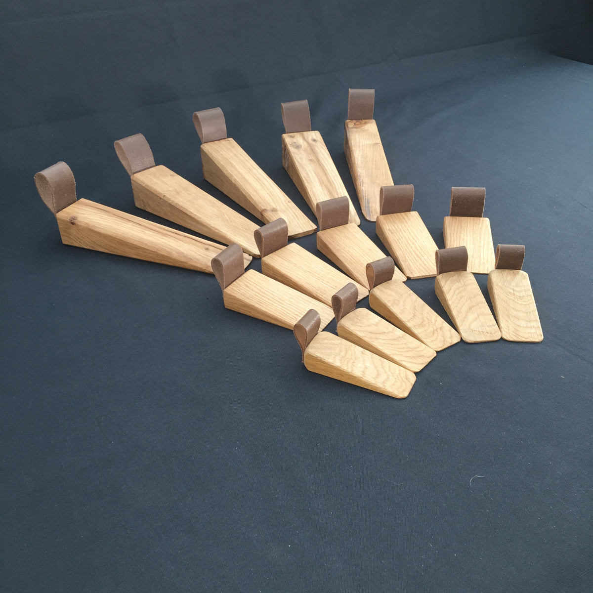 Door Wedges. Solid Oak door wedges with faux leather handle.