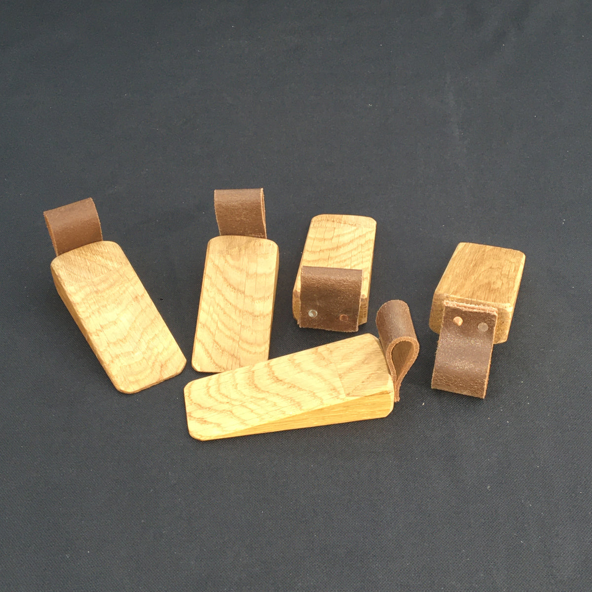 Door Wedges. Solid Oak door wedges with faux leather handle.