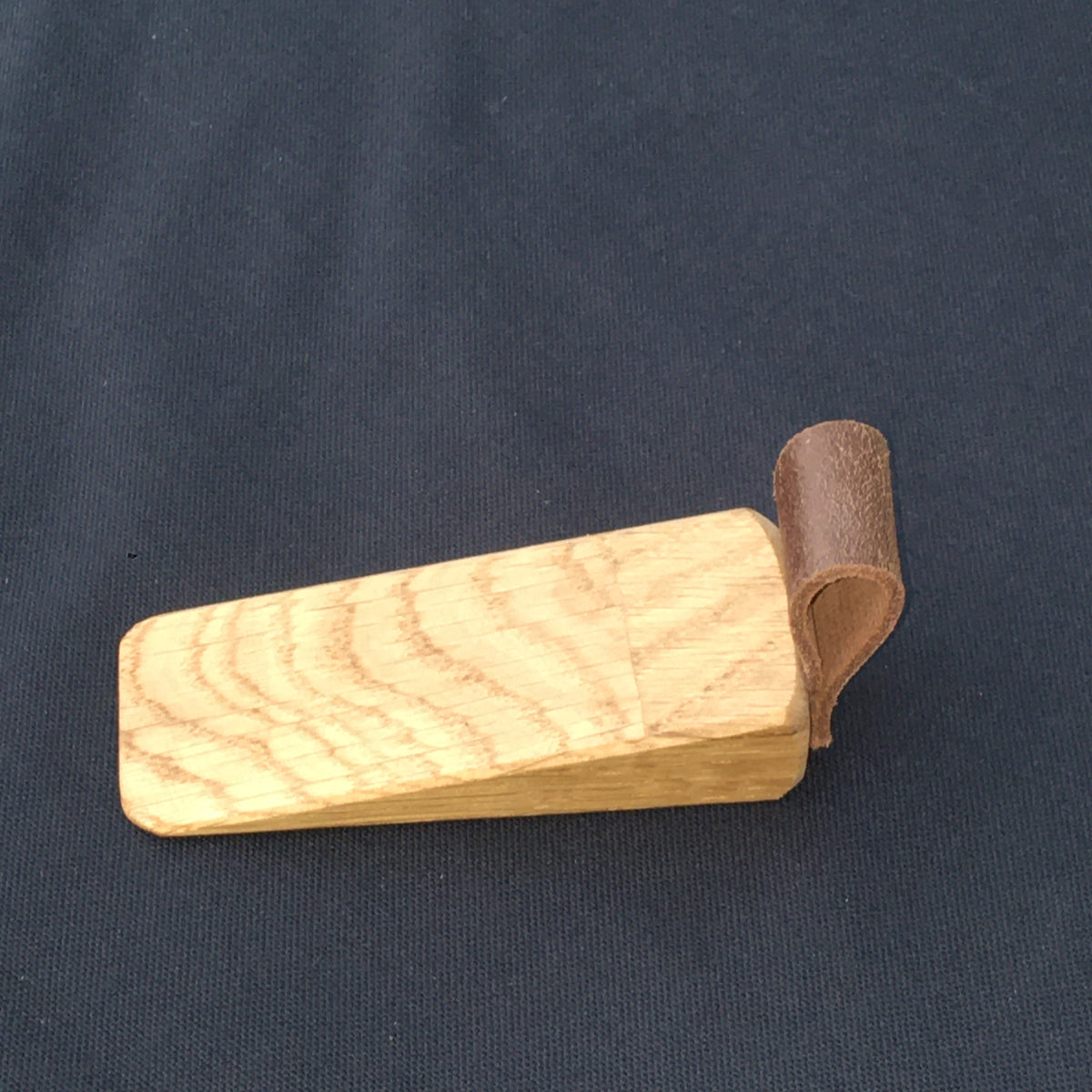 Door Wedges. Solid Oak door wedges with faux leather handle.