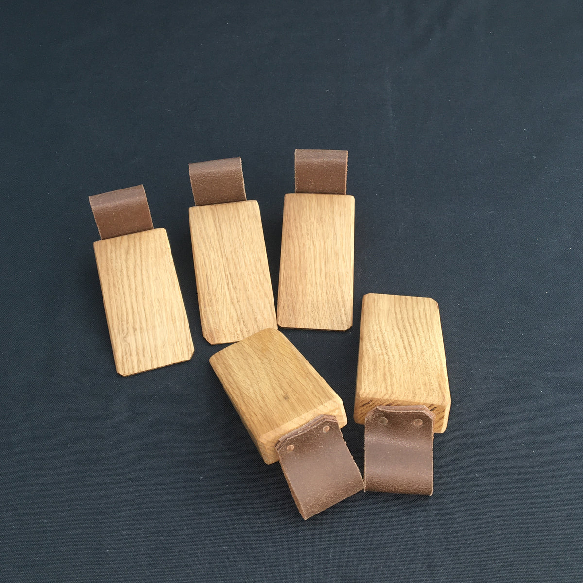 Door Wedges. Solid Oak door wedges with faux leather handle.