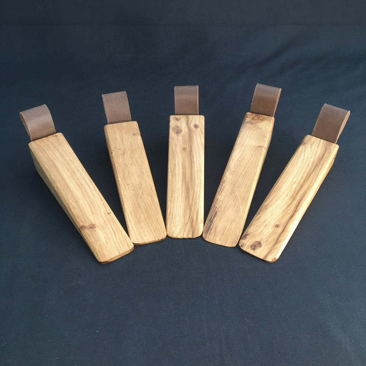 Door Wedges. Solid Oak door wedges with faux leather handle.