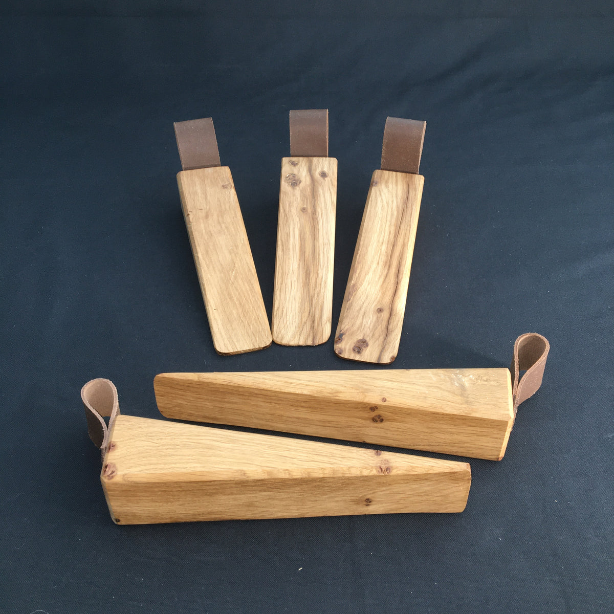 Door Wedges. Solid Oak door wedges with faux leather handle.