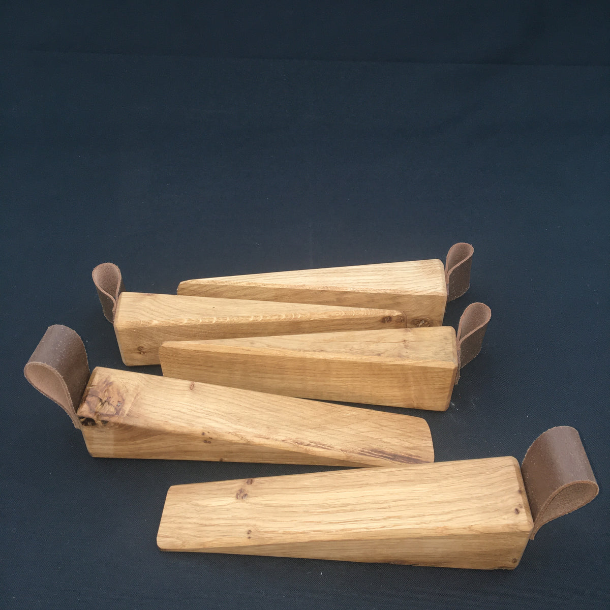 Door Wedges. Solid Oak door wedges with faux leather handle.