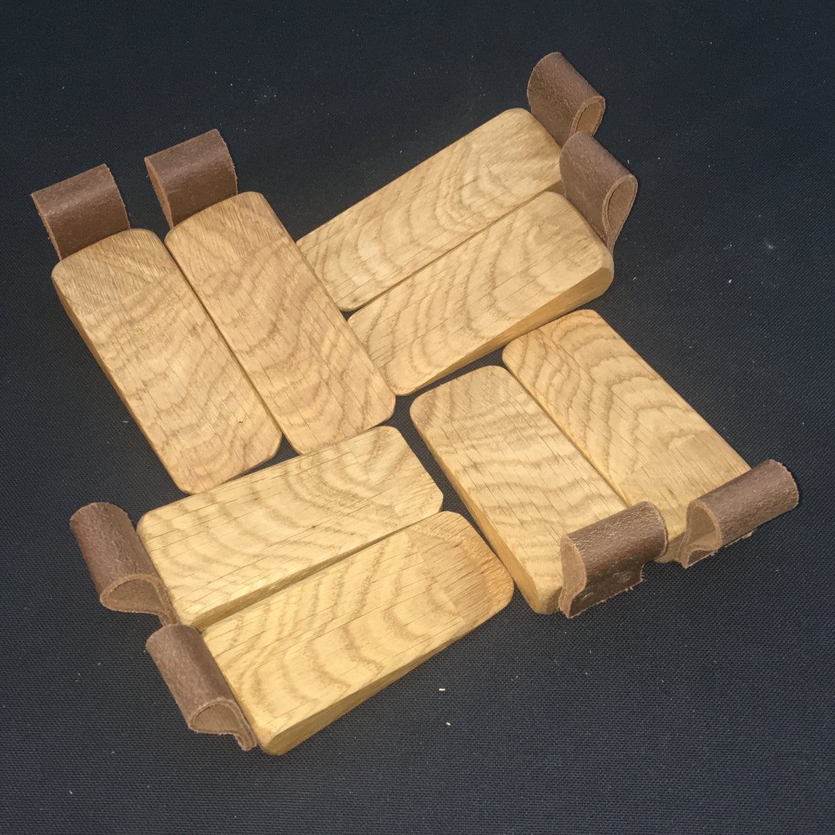 Door Wedges. Solid Oak door wedges with faux leather handle.