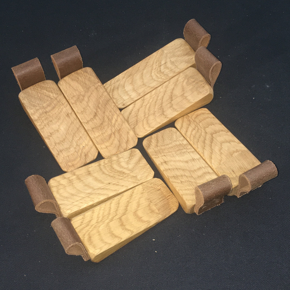 Door Wedges. Solid Oak door wedges with faux leather handle.