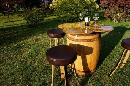 Four-leaf clover table from vintage Oak wine barrels with stools: home interiors, restaurant &amp; catering events. Handcrafted in our Gloucestershire workshop. The Fine Wooden Article Company.