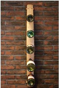 A 5 bottle wall-mounted wine rack designed from a vintage Oak barrel stave for home &amp; commercial interiors, handcrafted in our Gloucestershire workshop, UK.