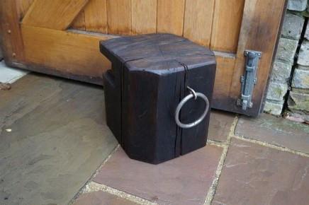 Solid Oak Doorstop for the home, handcrafted from a sustainably sourced reclaimed Dock Beam with wrought iron mooring eye handles, Gloucestershire workshop, UK. The Fine Wooden Article Company.